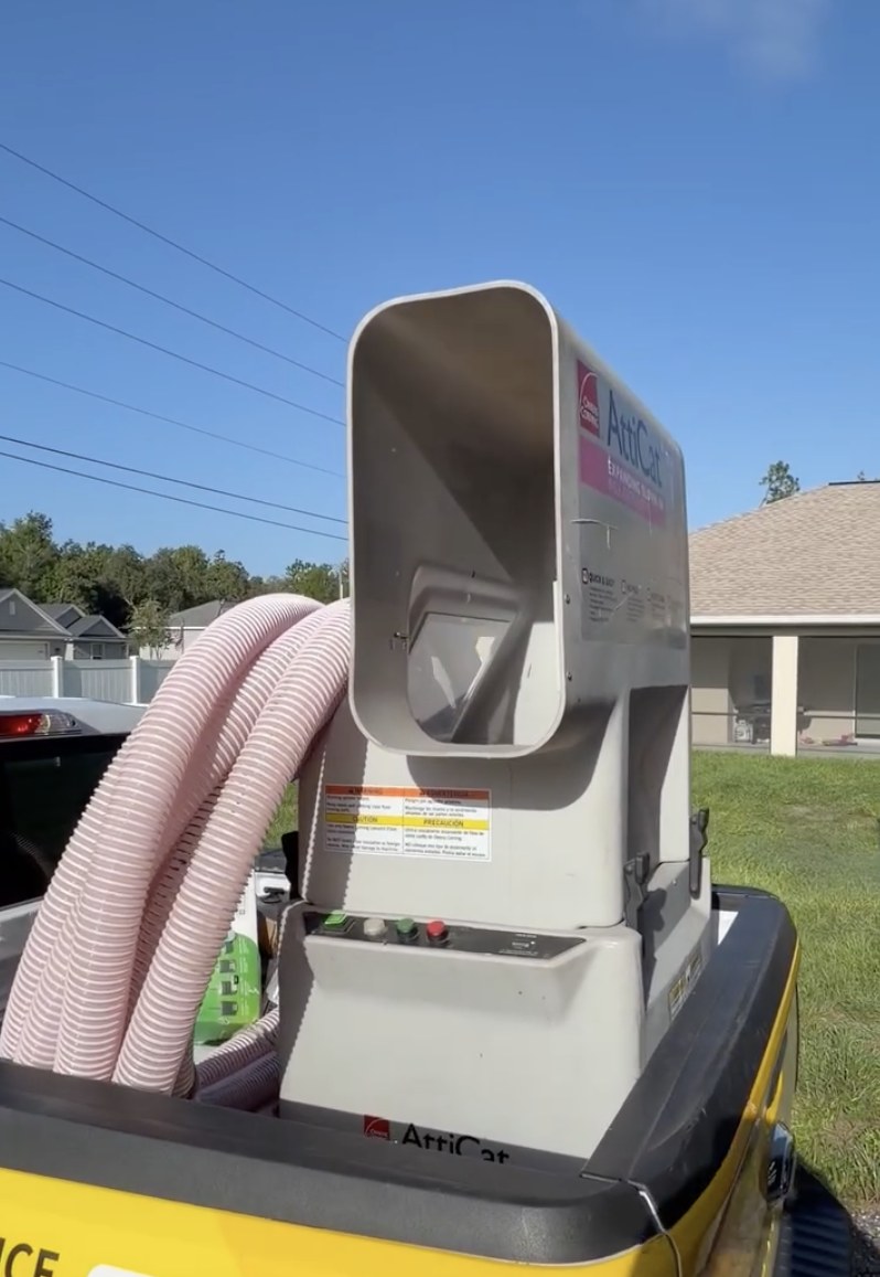 Our AttiCat blown-in insulation machine loaded in a Service Pros truck on a Pinellas County job